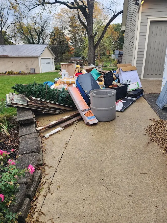 Dumpster being loaded with debris for Commercial Dumpster Rental in Augusta
